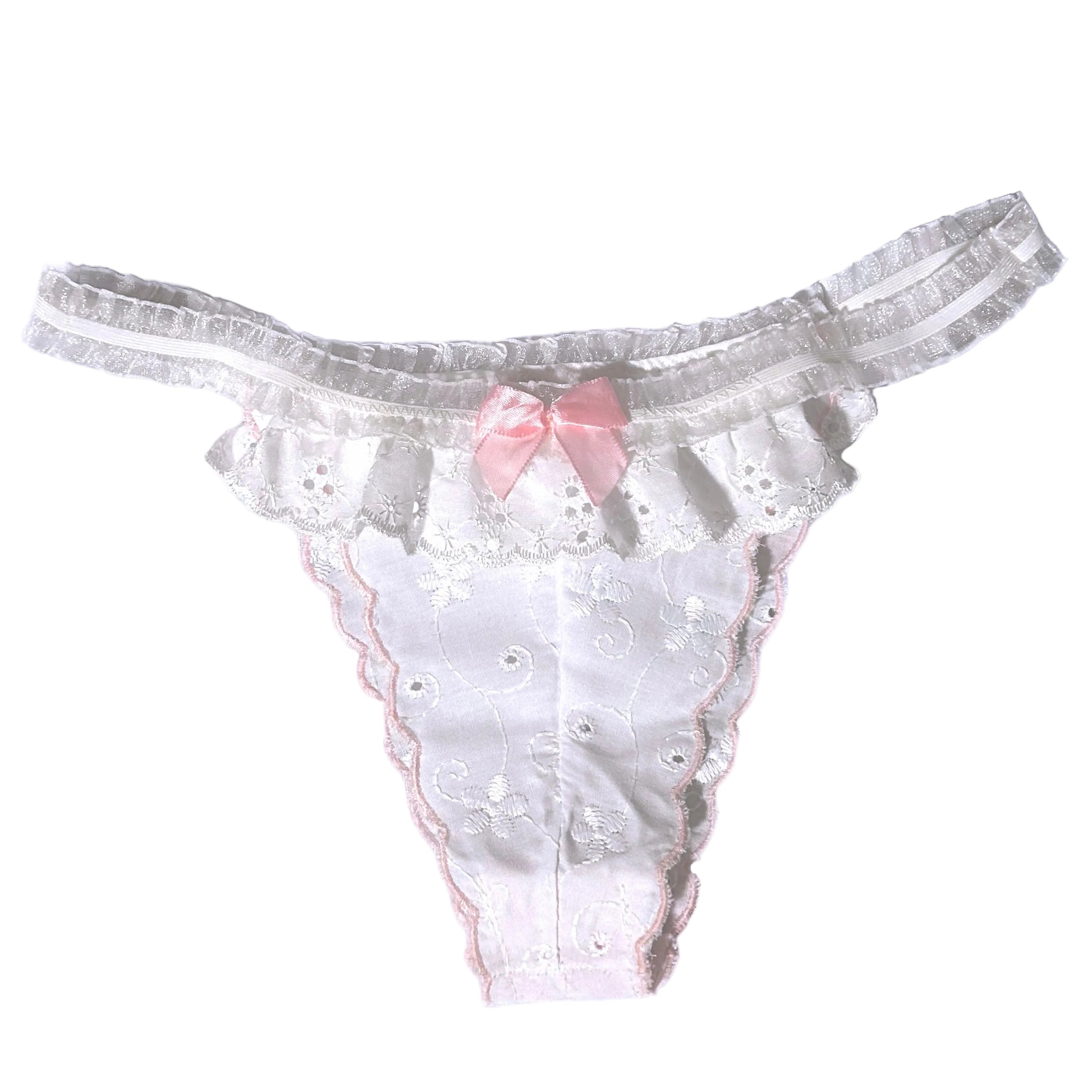 white lace panty with a a pink bow and scalloped detailing on a white background